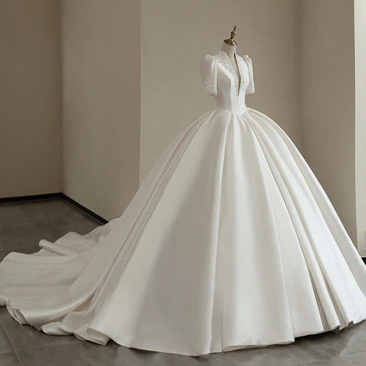 Nine Seven Appliques Plunging V-Neck Half Sleeves Ball Grown Satin Court Wedding Dress
